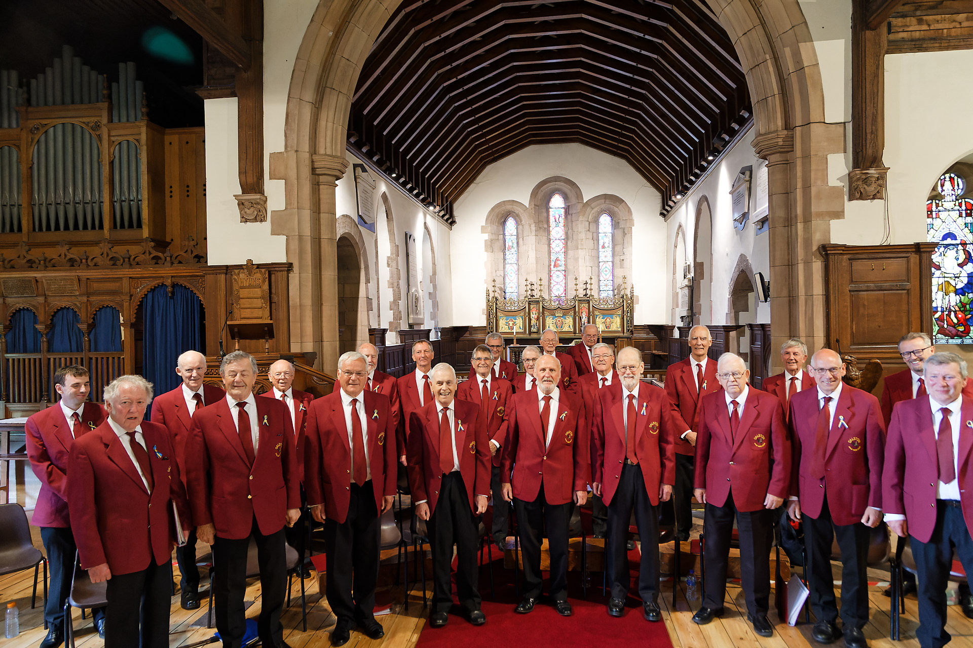 Dalston Male Voice Choir in performance dress inside a church